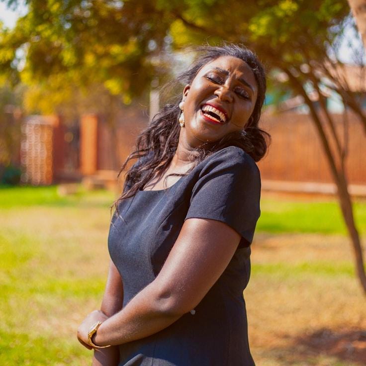 Kaveri Mehta, Lead Design Curator at BrightOceanNetwork, reviewing corporate floral arrangements